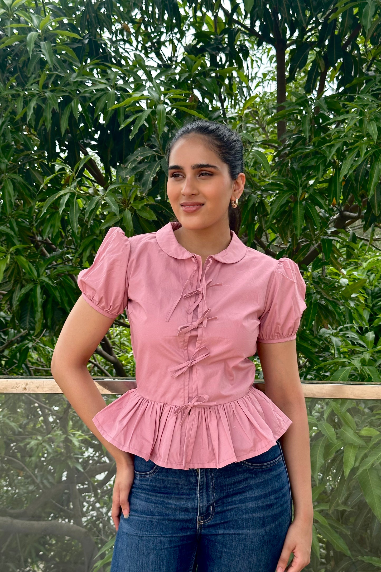 Sweet and feminine, this dusty pink top