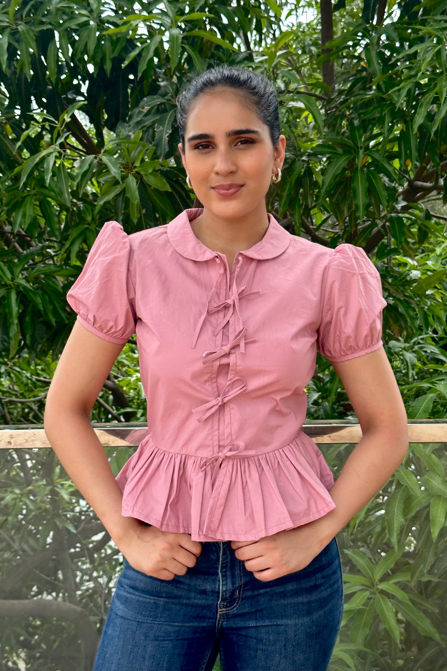 Sweet and feminine, this dusty pink top