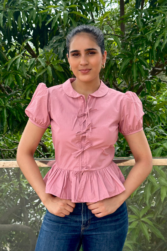 Sweet and feminine, this dusty pink top