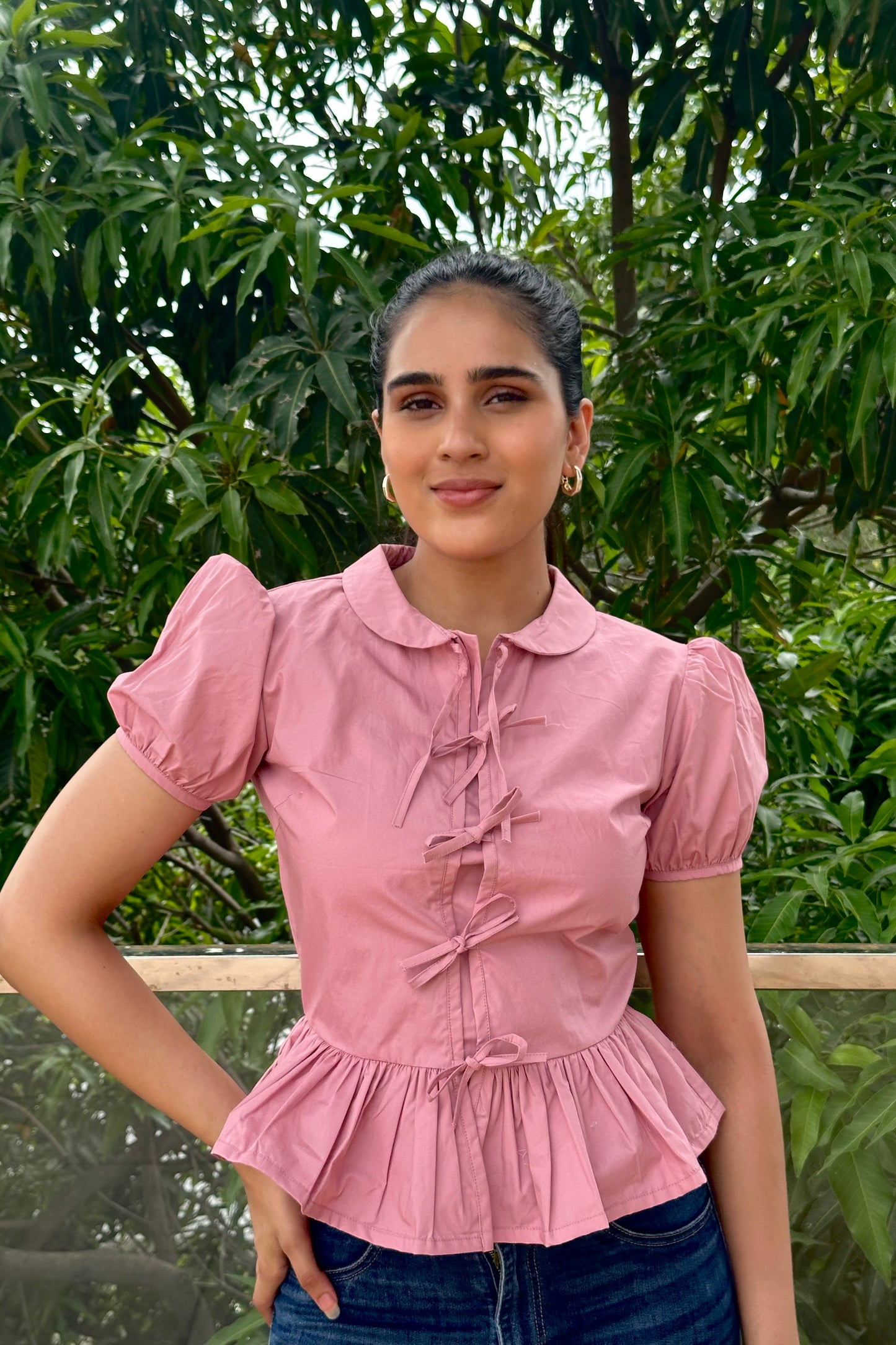 Sweet and feminine, this dusty pink top