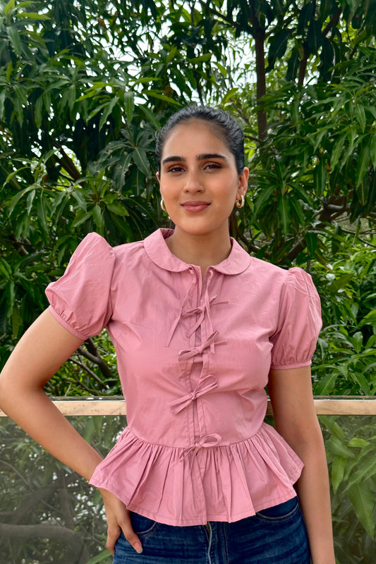 Sweet and feminine, this dusty pink top